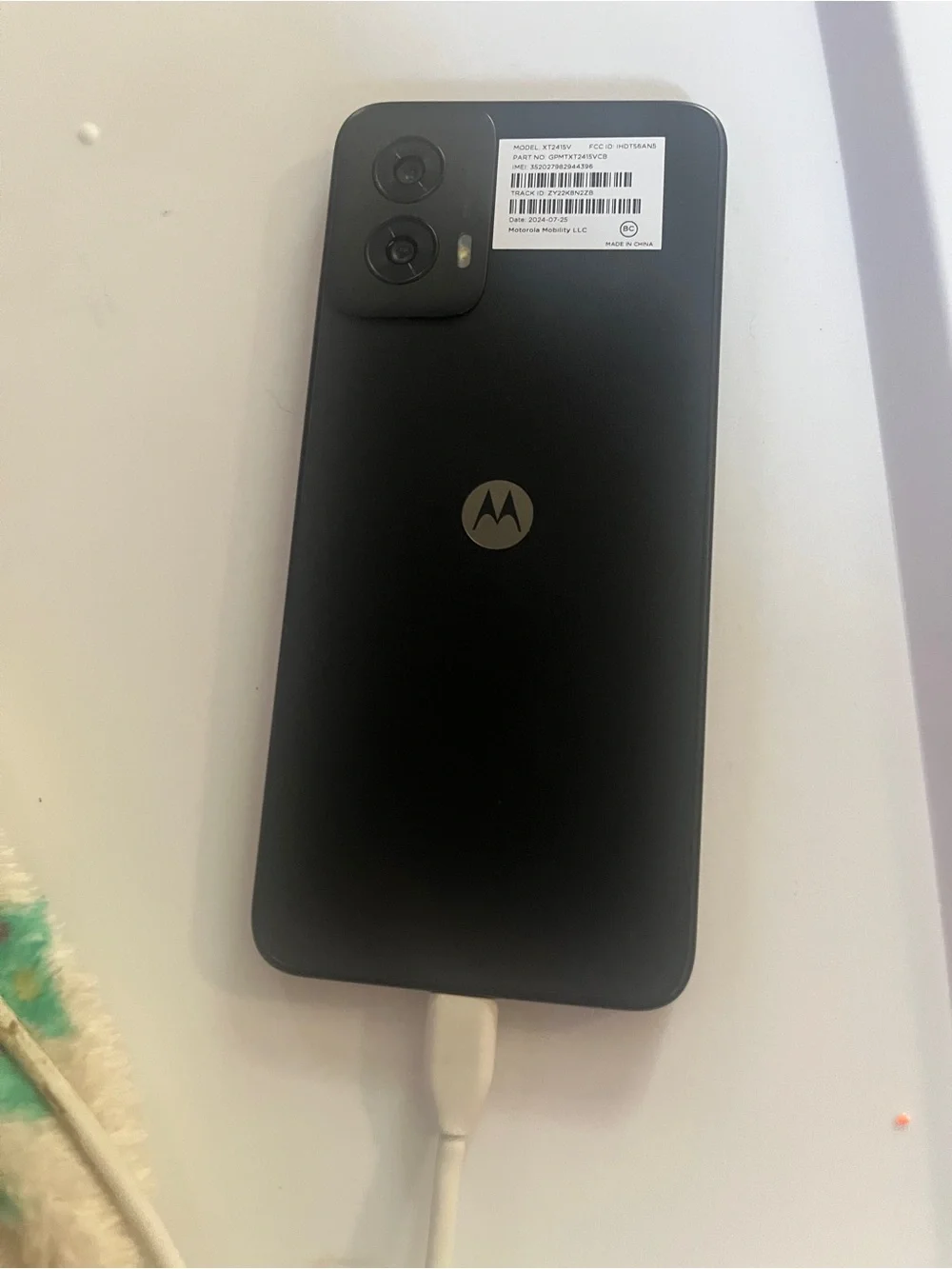 Motorola Black Smartphone with Pink & Purple Screen Accent